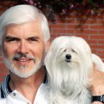 White haired man looks like his dog