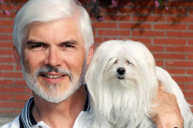 White haired man looks like his dog