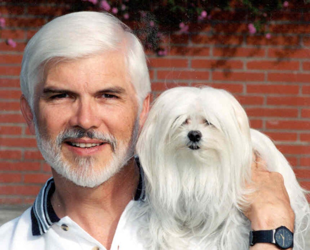 White haired man looks like his dog