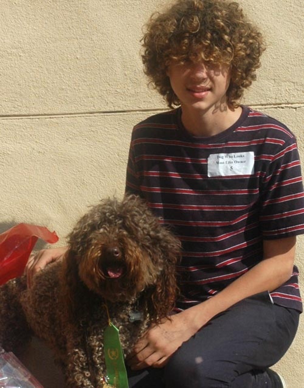 Curly haired guy with his dog